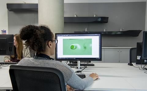 A student working at a computer.