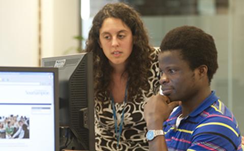 2 students looking at computer screen