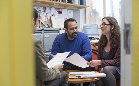 Picture of students discussing their work