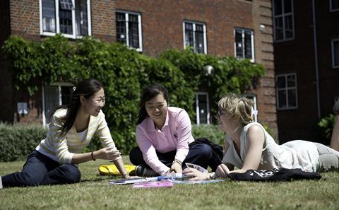 Students studying outside on campus