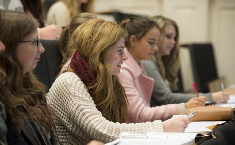 Smiling female student in a lecture