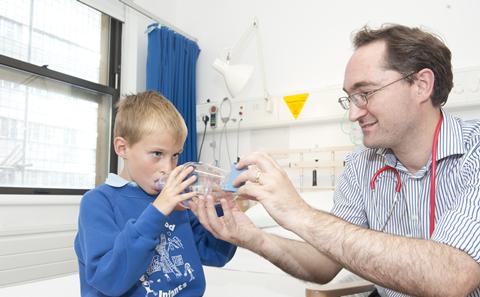 Doctor with child asthma patient