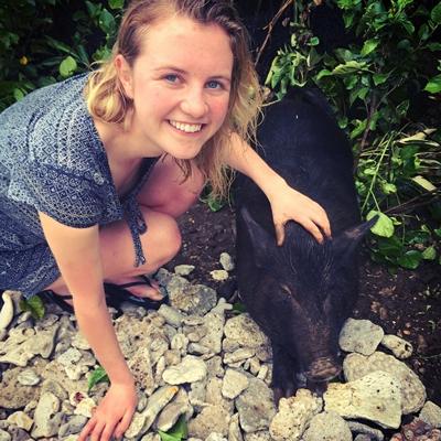 Heather Brown with Eda the pig in Samoa.
