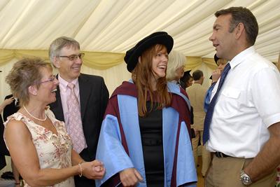 with her parents and Dr Nick Maguire