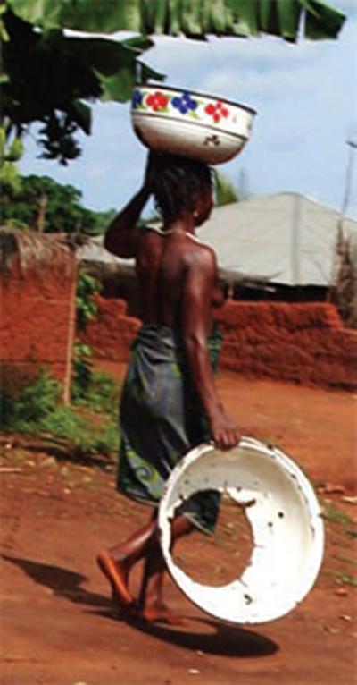 African woman carrying water