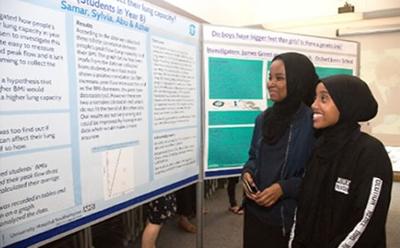 Students view research posters