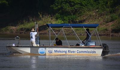 Researchers on Mekong River Commission boat