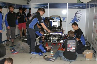 Image of team working on car