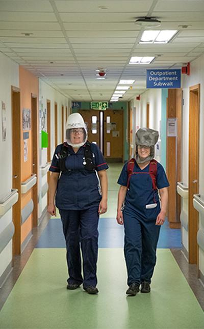 NHS staff walking through the hospital wearing PeRSos, image by Ric Gillams