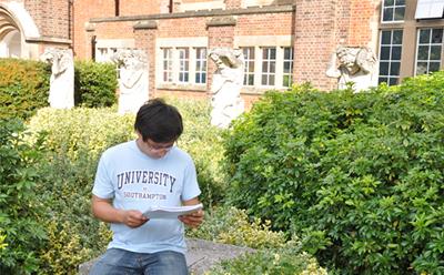Student working by library outside
