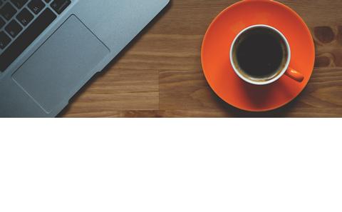 A cup of tea by a laptop