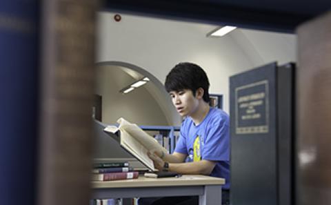 Student reading a book