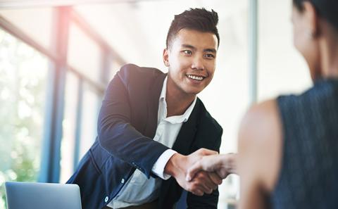 Shaking hands at a job interview