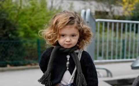 Child with a Chanel bag