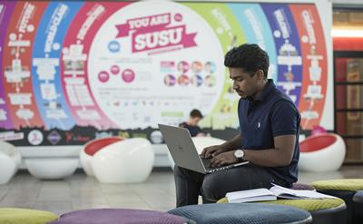 Student on laptop in SUSU