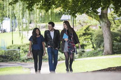 Students walking through the park