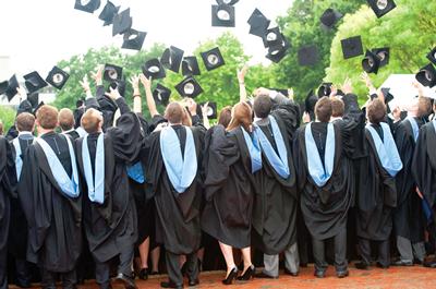 Graduates hats in air