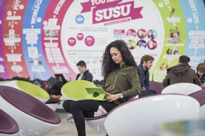 Girl sat on beanbag studying