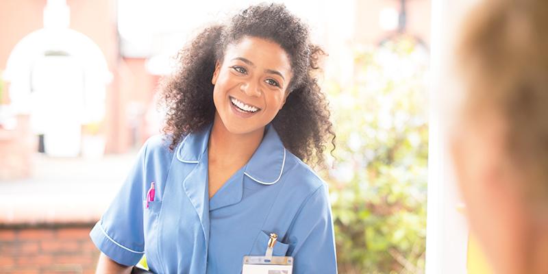 Nurse entering elderly patient's home