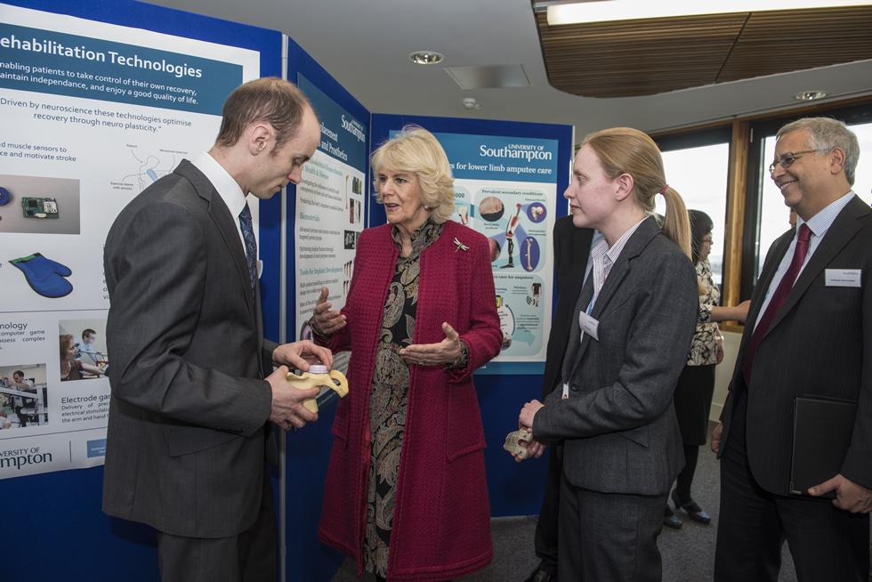 The Duchess of Cornwall talking with Dr Alex Dickinson and Katy Rankin