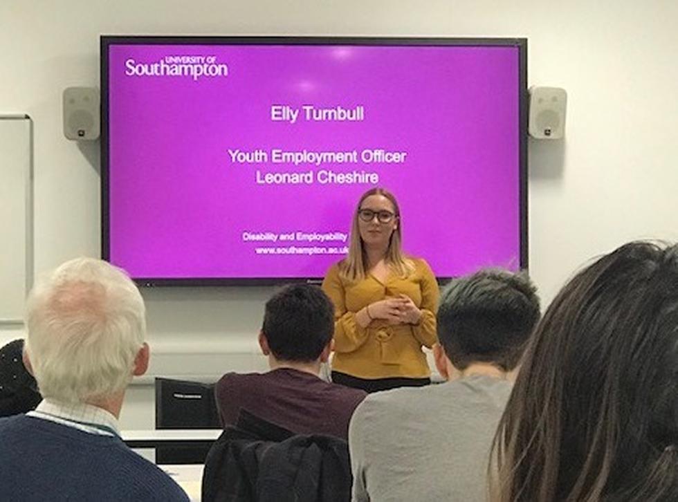 Speaker Elly Turnbull from Leonard Cheshire presenting to the audience - Change 100 at our November 2018 event