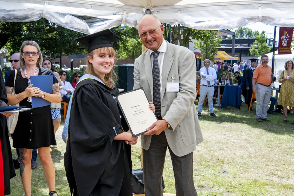 Student receiving graduation certificate  