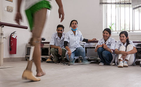 Medics assessing prosthetics