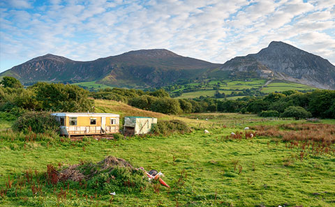 Abandoned caravan in countryside