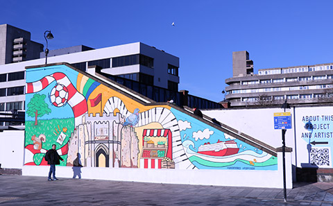 Colourful mural on railway bridge