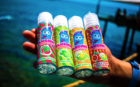 Colourful cannisters of e-cigarette liquids with childish designs