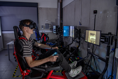 A student using a 2-DOF motion seat with VR headset