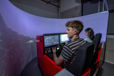 Students using the full-fixed base touchscreen cockpit simulator