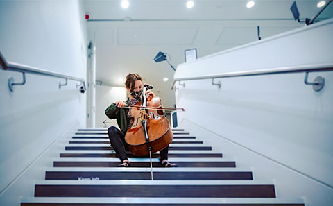 Musician on set of stairs