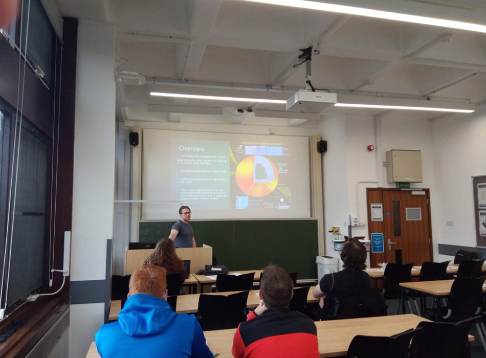 Second year PhD student Marcus Hatton giving a talk about his research on neutron star mergers.