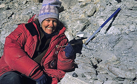 Professor Dame Jane Francis with fossil wood in Antarctica