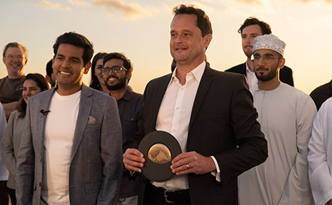 Prof Juerg Matter with Earthshot trophy next to CEO Talal Hasan (left)