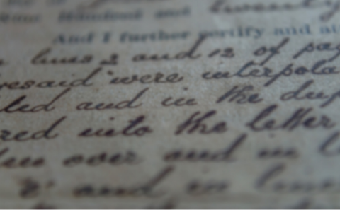 Close up blurred image of text on an archive document 