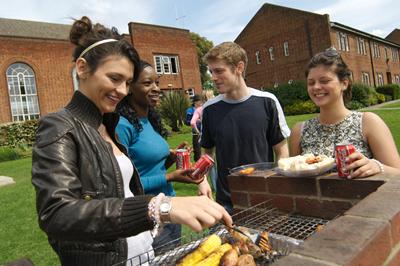 Students cooking on a barbeque