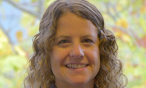 Lyn Ellett smiling at camera.