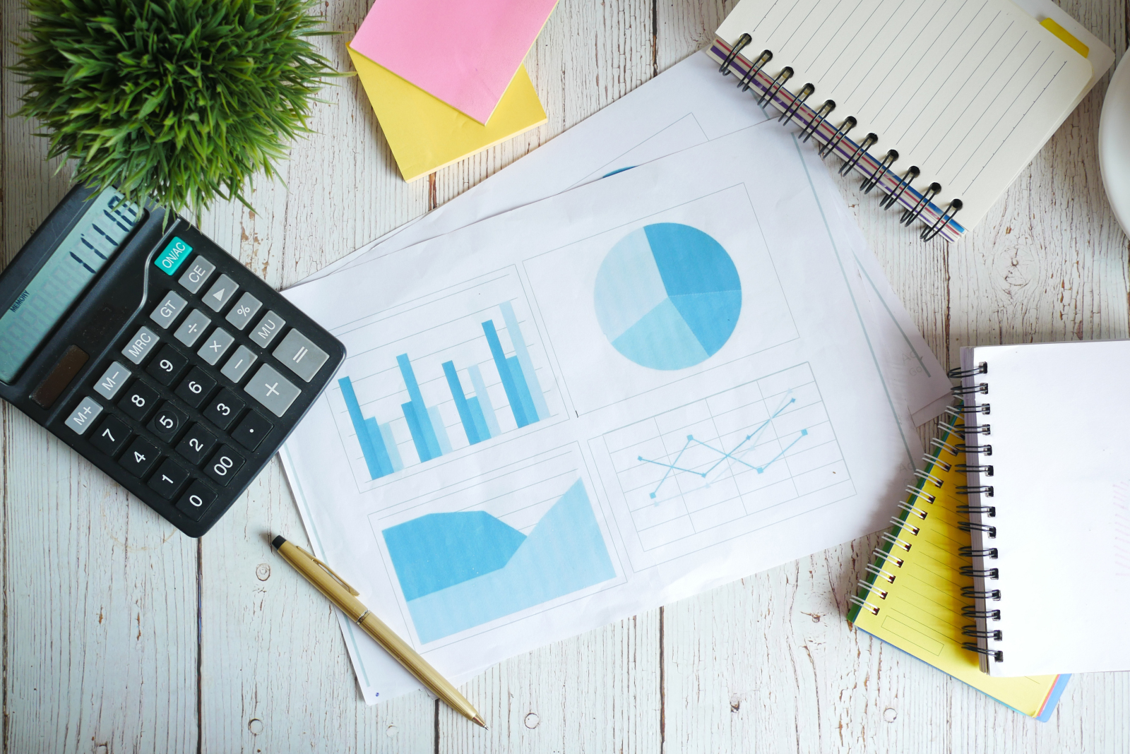 Notebook, paper including graphs and a calculator