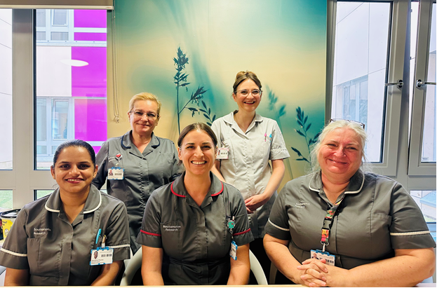 The adult reserach nursing team smile at the camera