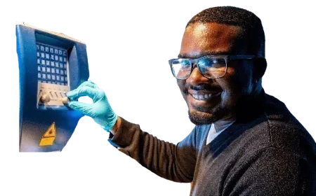 PhD researcher Marlon McCarthy operates a machine