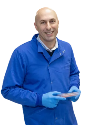 Stephen Beers, in protective gear, smiles broadly