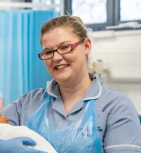 Head and shoulders portrait images of Maria McNeill in her uniform smiling at the camera