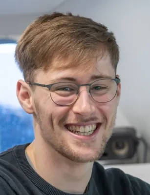 Head and shoulders of Daniel Hampton smiling at the camera.