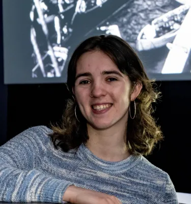 Head and shoulders portrait image of Sacha Wood, BA Film and English with Year Abroad student smiling at the camera.