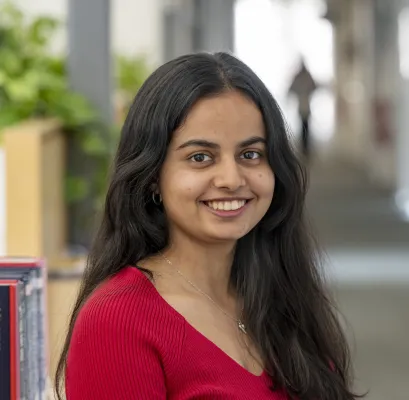 Head and shoulders portrait image of Vrunda Vasani, MA Creative Writing student, smiling at the camera.
