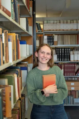Ella Meekings, History student, in the library