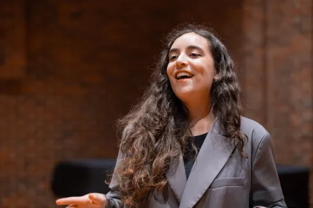 Maria Cristovao Cabacos Martins singing in the Turner Sims hall.