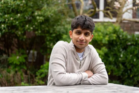 Vinay sitting outside at a table